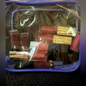Lune -Aster small 9 count lipsticks with wand. New in plastic zippered pouch.